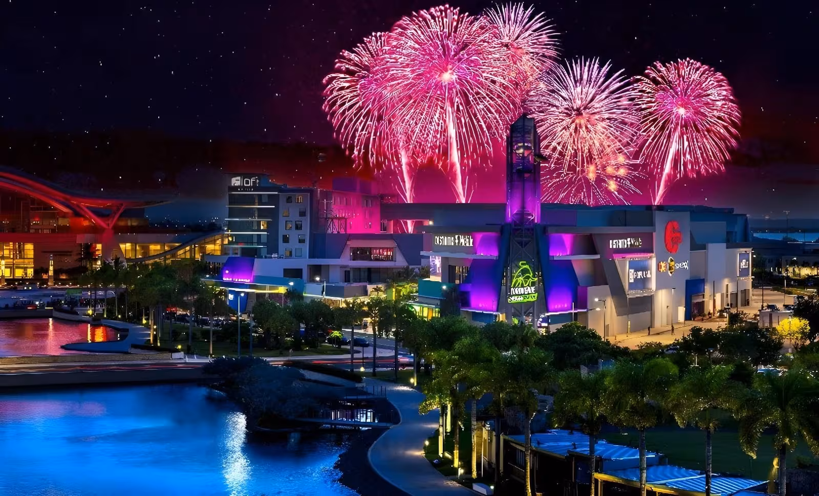 Aerial view of the Puerto Rico Convention Center District lit up at night with fireworks